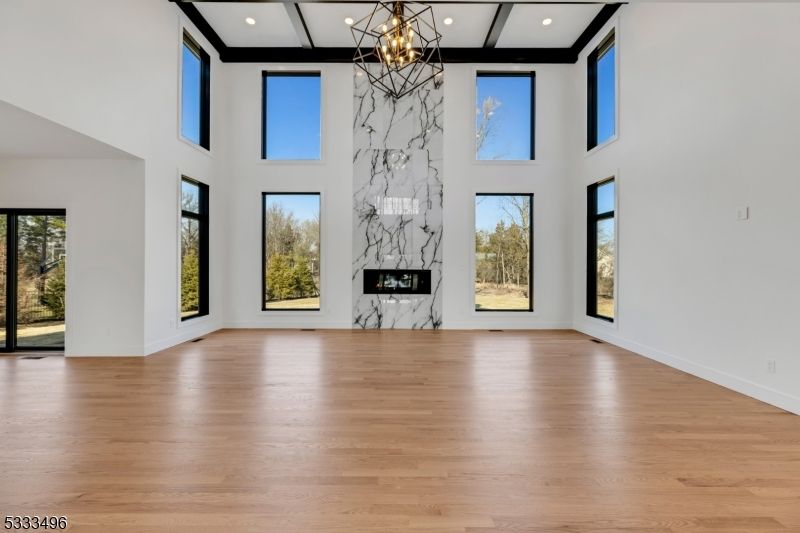 Empty room, Fireplace, Interior, Pendant Lights, Recessed Lighting, Wood Texture Flooring