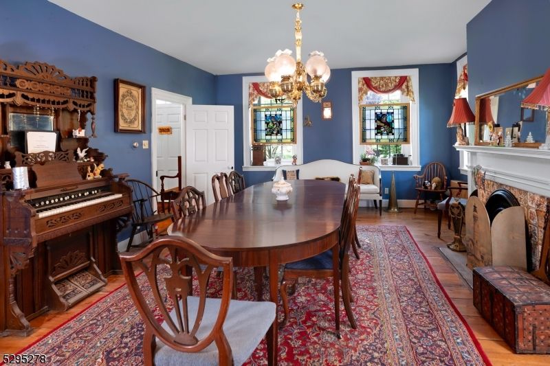 Chandelier, Dining room, Fireplace, Interior, Piano, Wood Texture Flooring