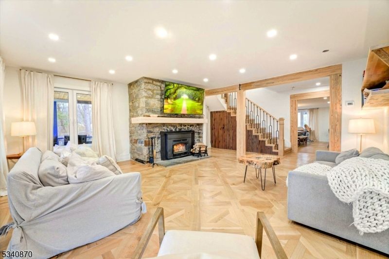 Fireplace, Interior, Living room, Recessed Lighting, Stone Walls, Wood Texture Flooring