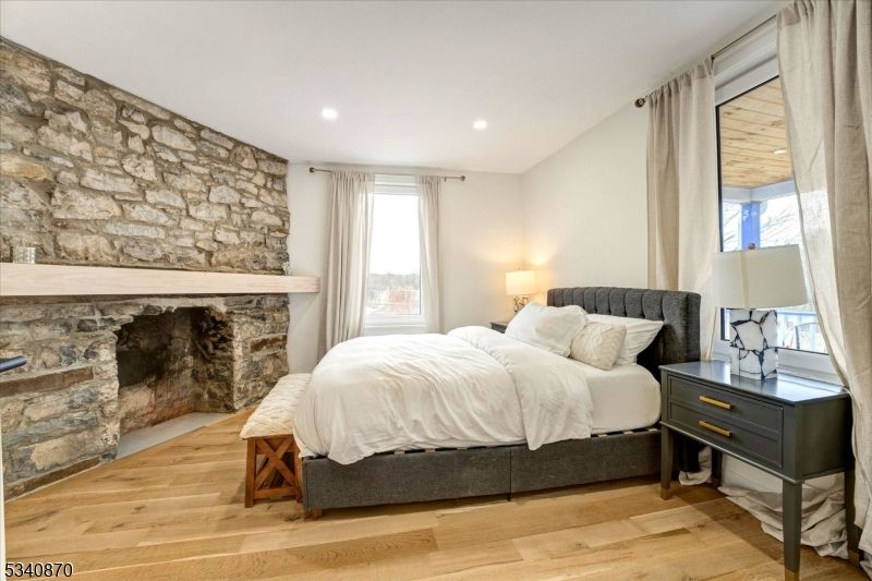 Bedroom, Fireplace, Interior, Recessed Lighting, Stone Walls, Wood Texture Flooring