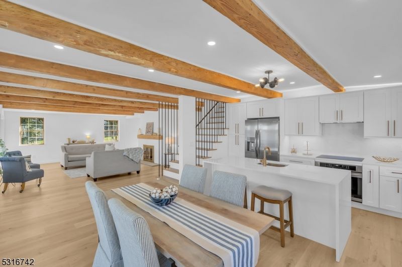 Dining room, Interior, Kitchen, Living room, Recessed Lighting, Stainless Steel Appliances, Wooden Beams, Wood Texture Flooring