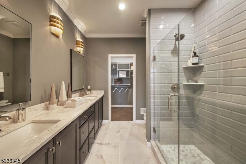 Bathroom, Dual Sink Vanities, Glass Shower, Interior, Marble, Recessed Lighting, Wood Texture Flooring