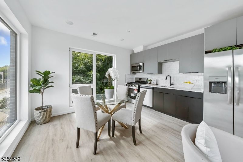 Dining room, Interior, Kitchen, Recessed Lighting, Stainless Steel Appliances, Wood Texture Flooring