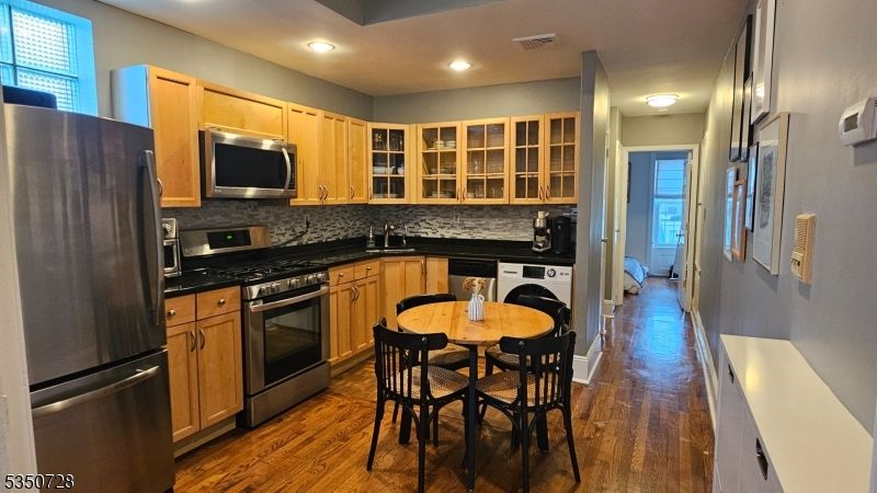 Dining room, Interior, Kitchen, Recessed Lighting, Stainless Steel Appliances, Wood Texture Flooring