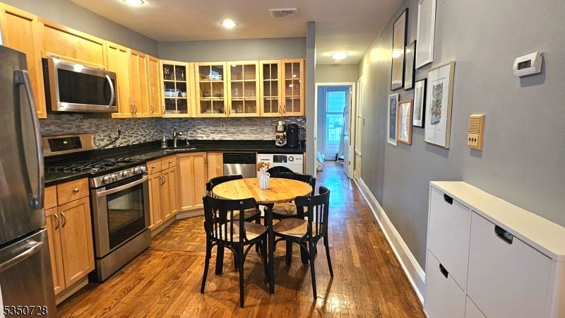 Dining room, Interior, Kitchen, Recessed Lighting, Stainless Steel Appliances, Wood Texture Flooring