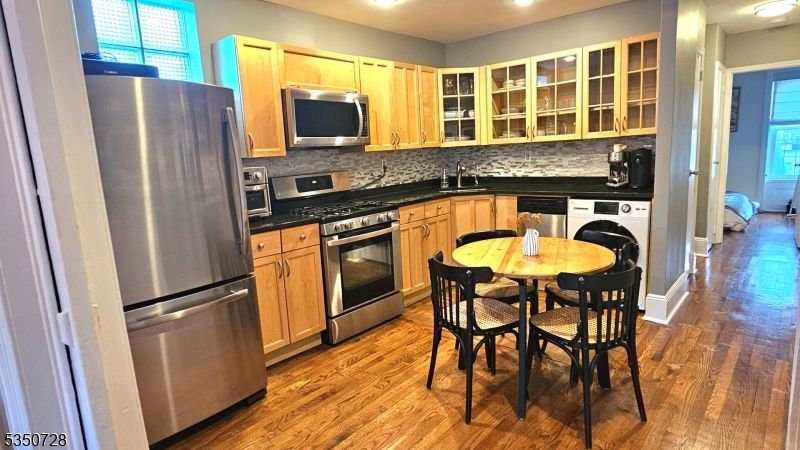 Dining room, Interior, Kitchen, Recessed Lighting, Stainless Steel Appliances, Washer, Wood Texture Flooring