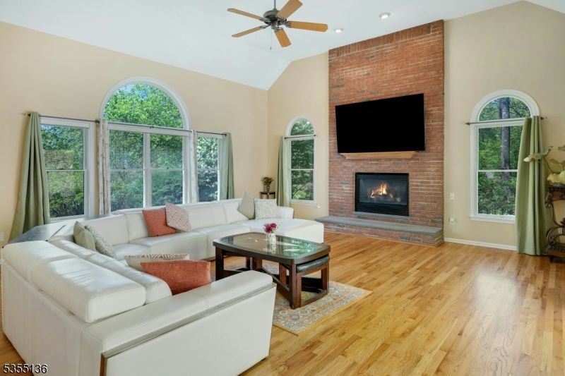 Fireplace, Interior, Living room, Recessed Lighting, Stone Walls, Wood Texture Flooring