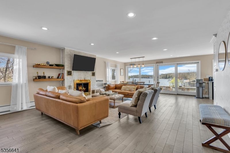 Fireplace, Interior, Living room, Pendant Lights, Recessed Lighting, Stone Walls, Wood Texture Flooring