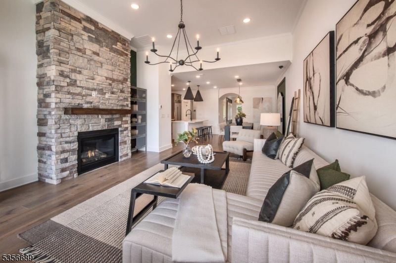 Chandelier, Fireplace, Interior, Kitchen, Living room, Pendant Lights, Recessed Lighting, Stone Walls, Wood Texture Flooring