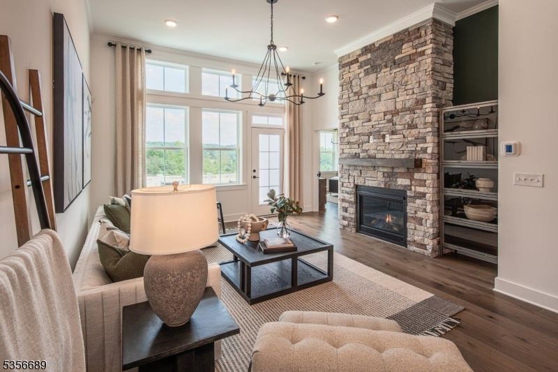 Chandelier, Fireplace, Interior, Living room, Recessed Lighting, Stone Walls, Wood Texture Flooring