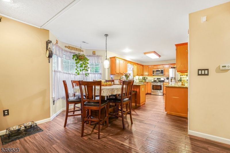 Dining room, Interior, Kitchen, Pendant Lights, Stainless Steel Appliances, Wood Texture Flooring