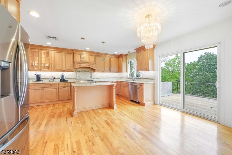 Chandelier, Interior, Kitchen, Recessed Lighting, Stainless Steel Appliances, Wood Texture Flooring