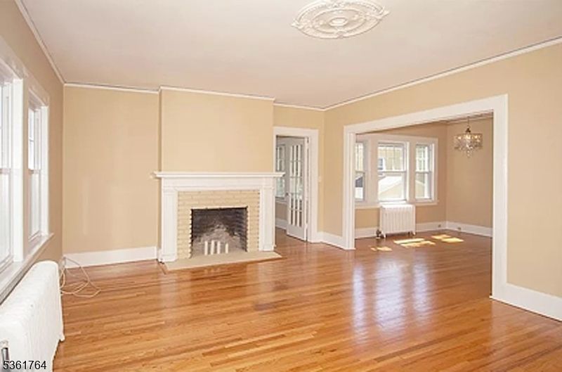 Chandelier, Empty room, Fireplace, Interior, Wood Texture Flooring