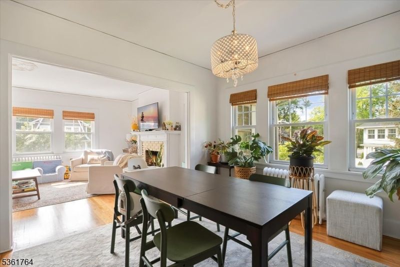 Chandelier, Dining room, Fireplace, Interior, Living room, Pendant Lights, Wood Texture Flooring
