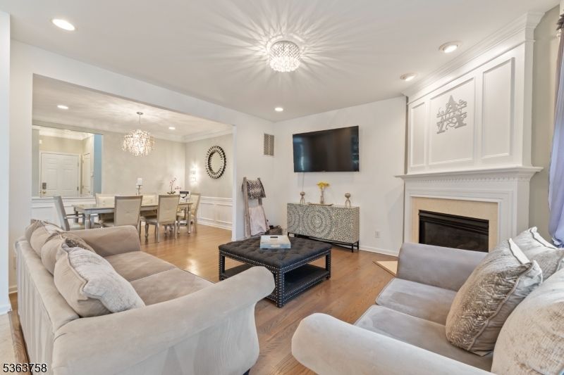 Chandelier, Dining room, Fireplace, Interior, Living room, Recessed Lighting, Wood Texture Flooring