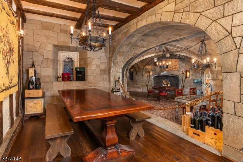 Chandelier, Dining room, Fireplace, Interior, Pendant Lights, Stone Walls, Wooden Beams, Wood Texture Flooring