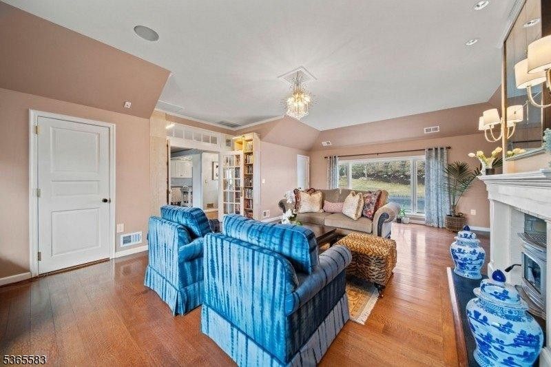 Chandelier, Fireplace, Interior, Living room, Recessed Lighting, Wood Texture Flooring
