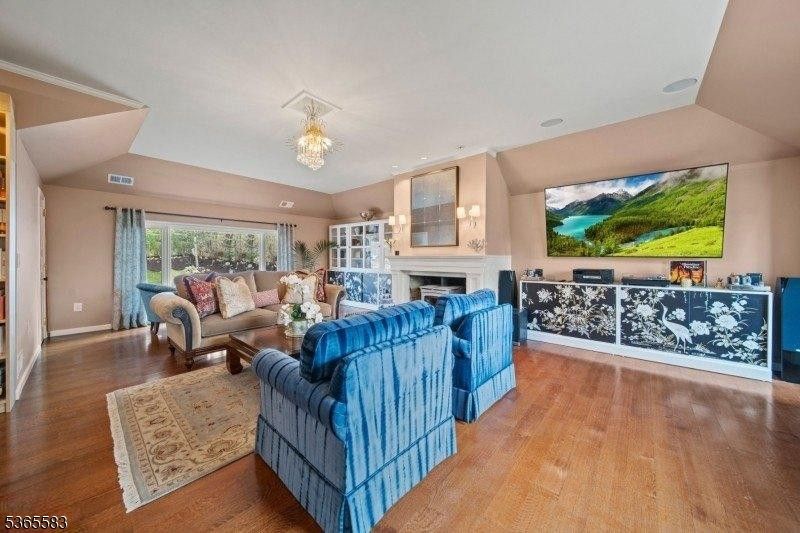 Chandelier, Fireplace, Interior, Living room, Recessed Lighting, Wood Texture Flooring
