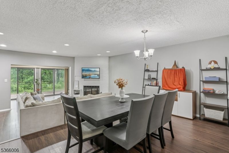 Chandelier, Dining room, Fireplace, Interior, Living room, Recessed Lighting, Wood Texture Flooring