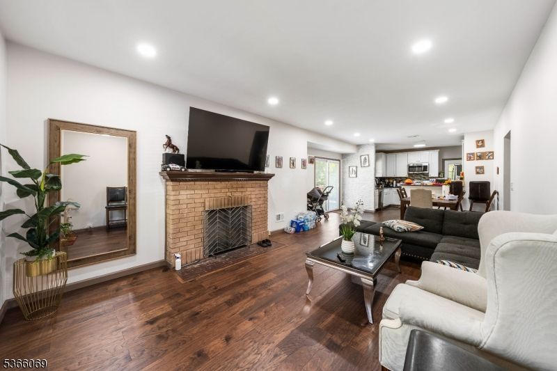 Dining room, Fireplace, Interior, Kitchen, Living room, Recessed Lighting, Wood Texture Flooring