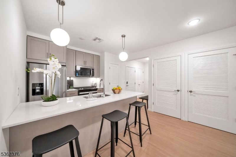 Interior, Kitchen, Pendant Lights, Recessed Lighting, Stainless Steel Appliances, Wood Texture Flooring