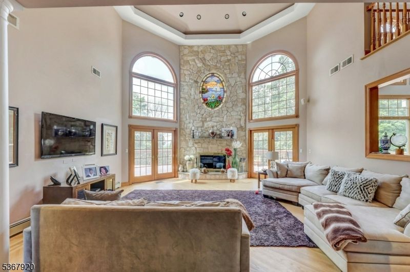 Fireplace, Interior, Living room, Recessed Lighting, Stone Walls, Wood Texture Flooring