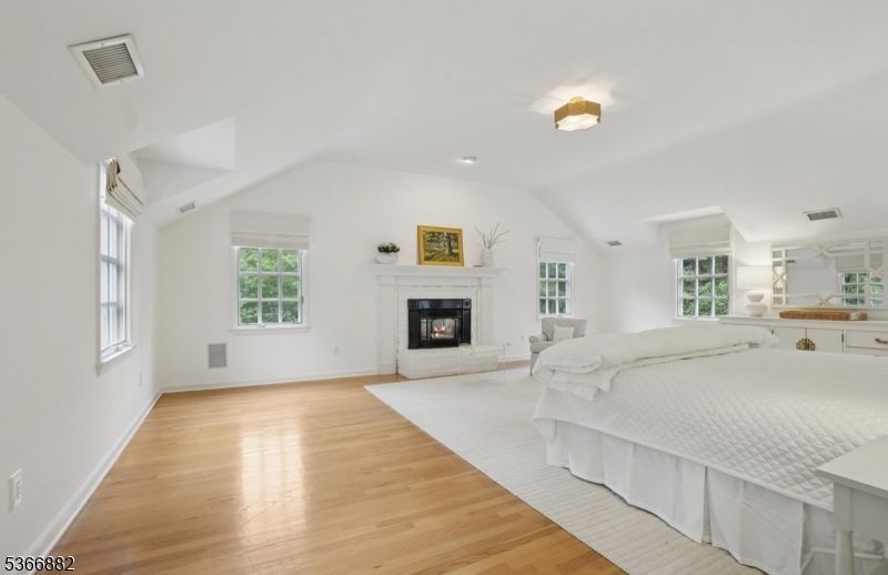 Bedroom, Fireplace, Interior, Recessed Lighting, Wood Texture Flooring
