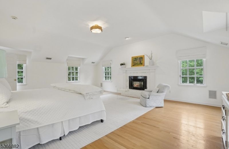 Bedroom, Fireplace, Interior, Recessed Lighting, Wood Texture Flooring