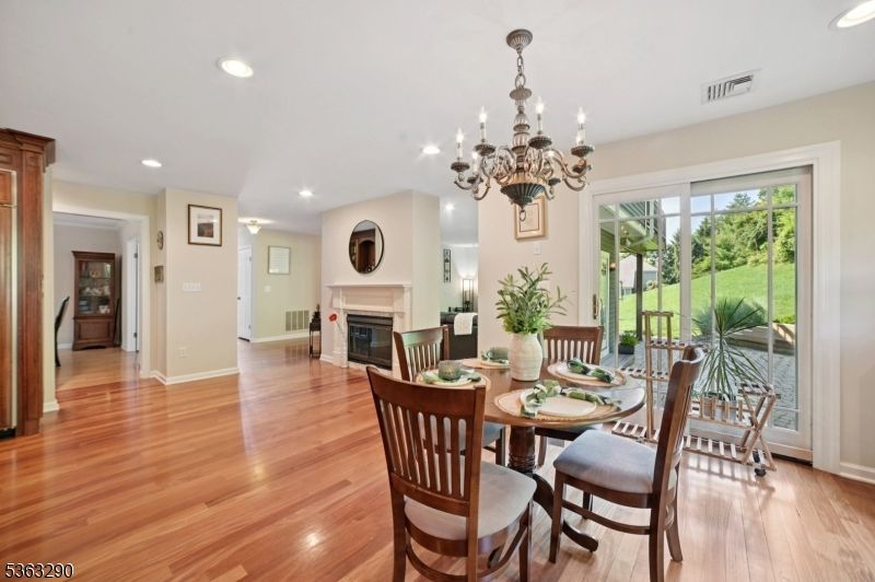 Chandelier, Dining room, Fireplace, Interior, Recessed Lighting, Wood Texture Flooring