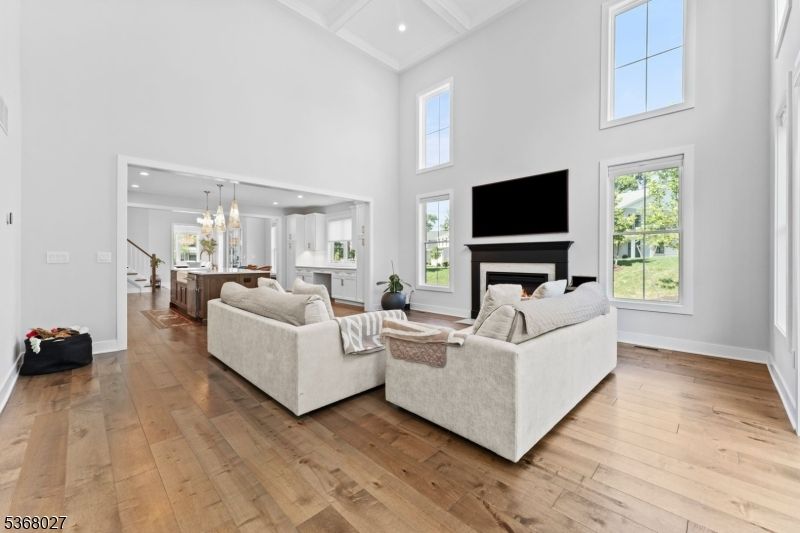 Chandelier, Fireplace, Interior, Living room, Pendant Lights, Recessed Lighting, Wood Texture Flooring