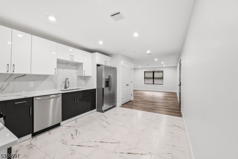 Interior, Kitchen, Marble, Marble Walls, Recessed Lighting, Stainless Steel Appliances, Wood Texture Flooring