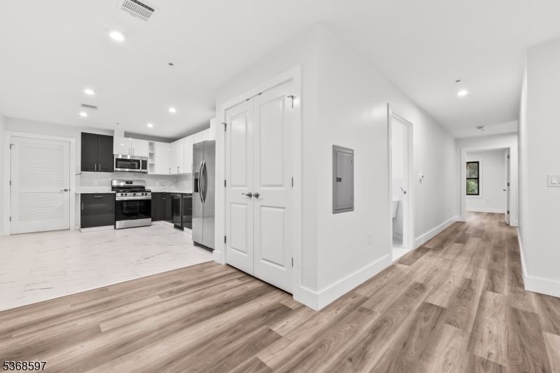 Interior, Kitchen, Marble, Recessed Lighting, Stainless Steel Appliances, Wood Texture Flooring