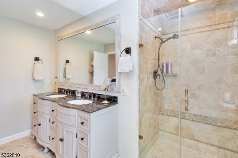 Bathroom, Dual Sink Vanities, Glass Shower, Interior, Recessed Lighting, Stone Walls