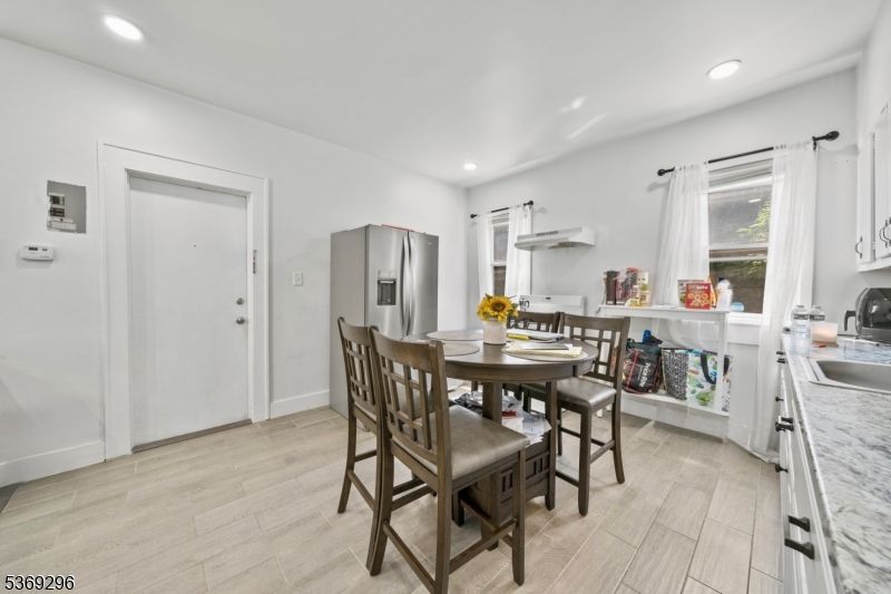 Dining room, Interior, Kitchen, Recessed Lighting, Stainless Steel Appliances, Wood Texture Flooring