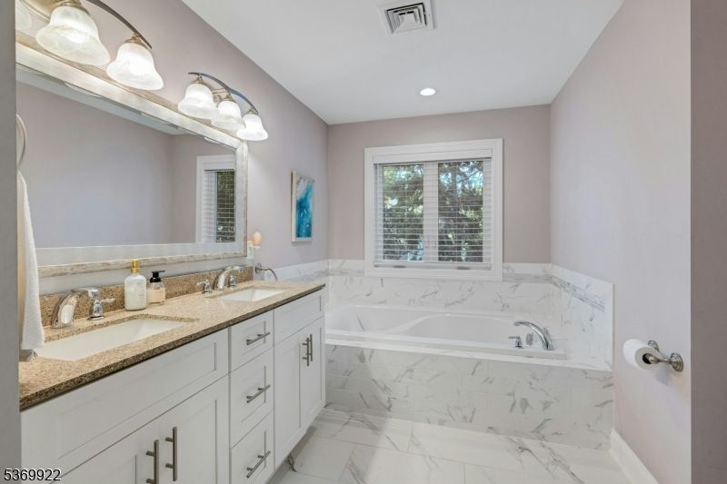 Bathroom, Dual Sink Vanities, Interior, Marble, Marble Walls, Recessed Lighting