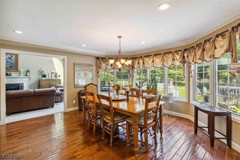 Chandelier, Dining room, Fireplace, Interior, Living room, Recessed Lighting, Wood Texture Flooring
