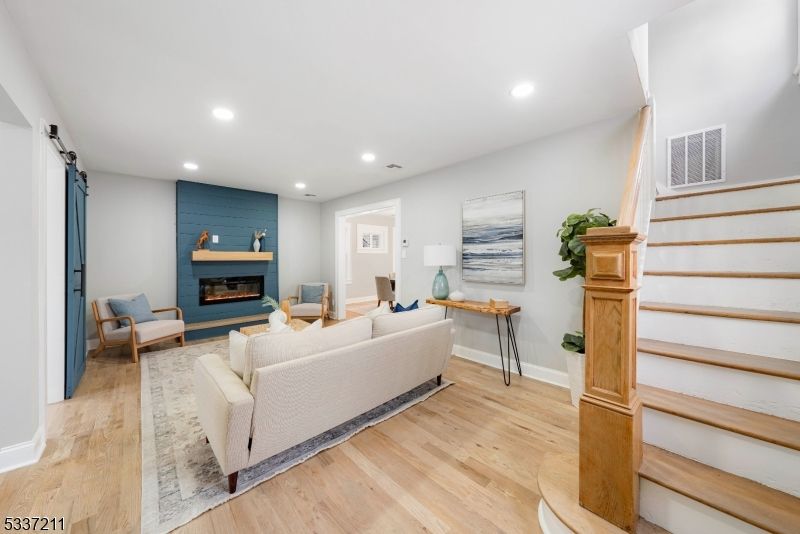 Fireplace, Interior, Living room, Recessed Lighting, Wood Texture Flooring