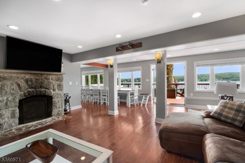 Dining room, Fireplace, Interior, Living room, Recessed Lighting, Wood Texture Flooring