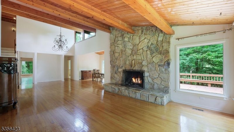 Chandelier, Empty room, Fireplace, Interior, Stone Walls, Wooden Beams, Wooden Ceilings, Wood Texture Flooring