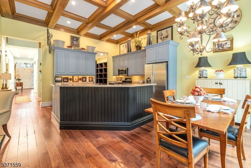 Chandelier, Dining room, Interior, Kitchen, Recessed Lighting, Stainless Steel Appliances, Wooden Beams, Wood Texture Flooring