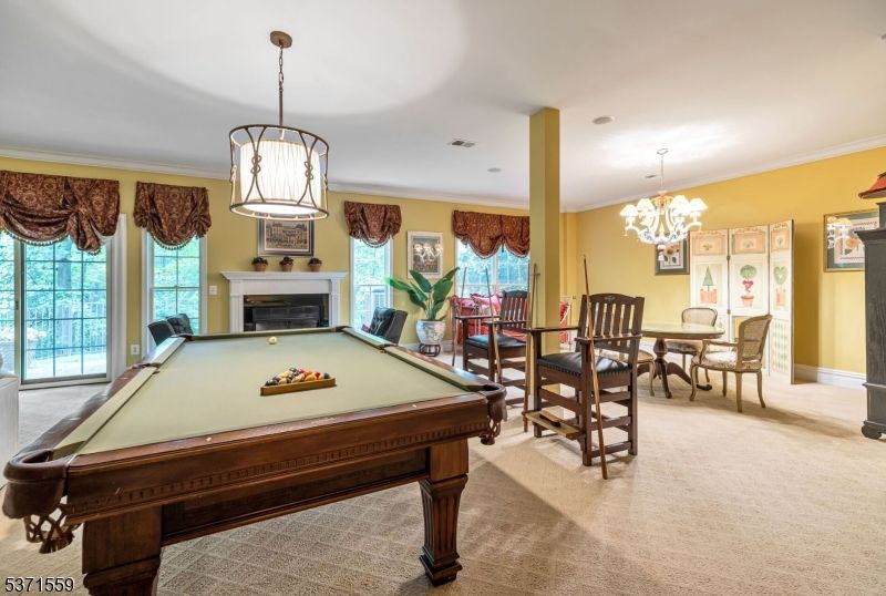 Billiard Table, Chandelier, Dining room, Fireplace, Game Room, Interior, Pendant Lights, Recessed Lighting