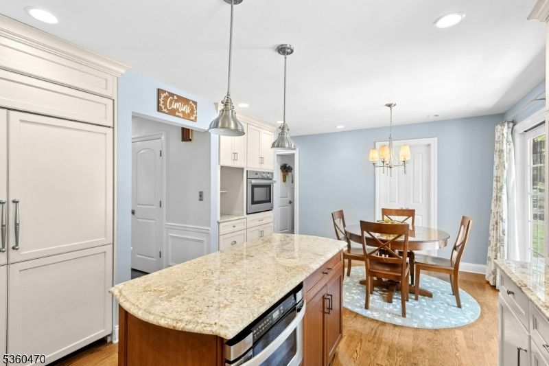 Chandelier, Dining room, Interior, Kitchen, Pendant Lights, Recessed Lighting, Stainless Steel Appliances, Wood Texture Flooring