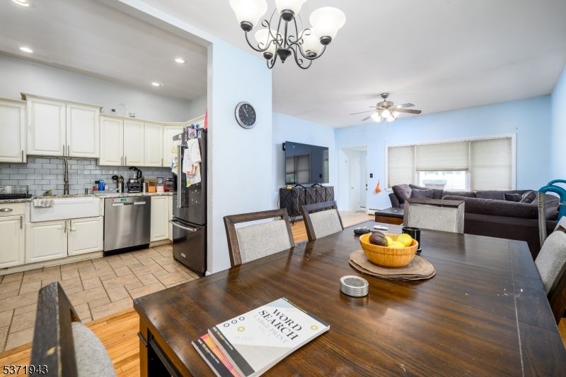 Chandelier, Dining room, Interior, Kitchen, Living room, Recessed Lighting, Stainless Steel Appliances, Wood Texture Flooring