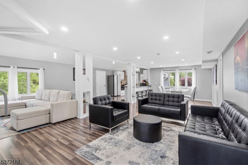 Dining room, Fireplace, Interior, Living room, Pendant Lights, Recessed Lighting, Wood Texture Flooring