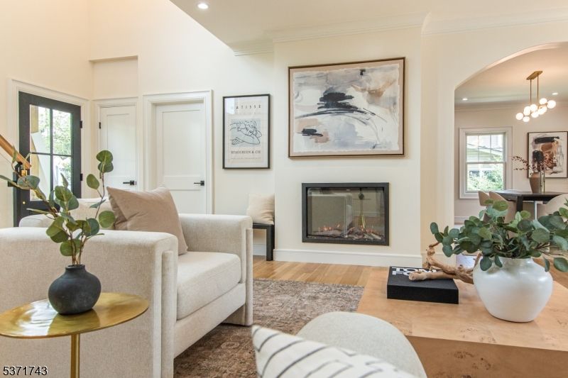 Chandelier, Fireplace, Interior, Living room, Pendant Lights, Recessed Lighting, Wood Texture Flooring