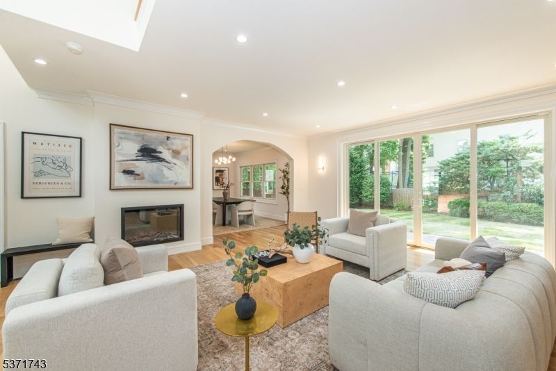 Fireplace, Interior, Living room, Piano, Recessed Lighting, Wood Texture Flooring