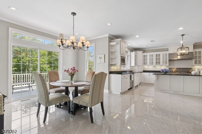 Chandelier, Dining room, Interior, Kitchen, Pendant Lights, Recessed Lighting, Stainless Steel Appliances