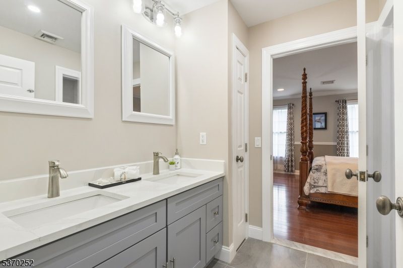 Bathroom, Dual Sink Vanities, Interior, Recessed Lighting, Wood Texture Flooring