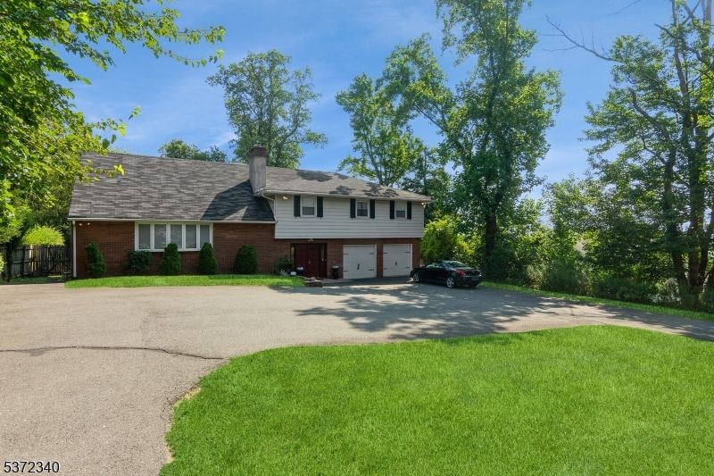 Attached, Backyard, Exterior, Facade, Brick Facade, Split Level