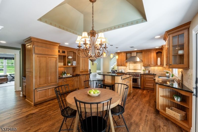 Chandelier, Dining room, Interior, Kitchen, Recessed Lighting, Stainless Steel Appliances, Wood Texture Flooring